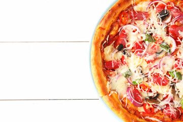 Tasty pizza with thin smoked sausages on white wooden table, top view. Space for text