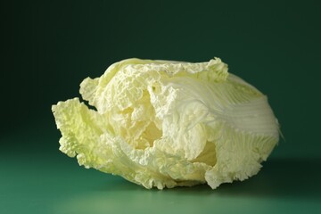 Fresh Chinese cabbage on green background, closeup