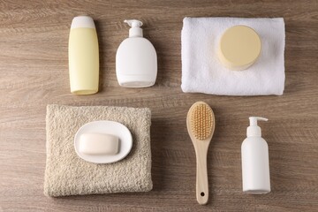 Different bath accessories on wooden background, flat lay