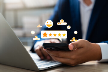 Consumer use smartphone to complete online customer satisfaction survey, rating 5 stars for...
