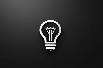 A solitary white light bulb icon shines against a stark black backdrop