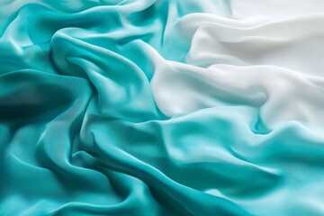 Obraz premium Elegant turquoise and white silk fabric texture.