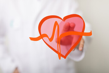 Image of a doctor holding a heart with a heartbeat line. Perfect for medical, healthcare, and...