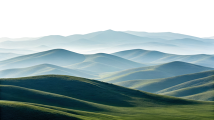 Rolling green hills stretch into misty blue mountains under a dramatic sky, creating a serene and layered landscape.