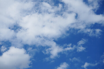 Blue sky with fluffy clouds.