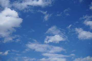 Blue sky with fluffy clouds.
