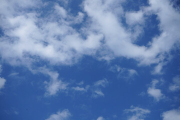 Blue sky with fluffy clouds.