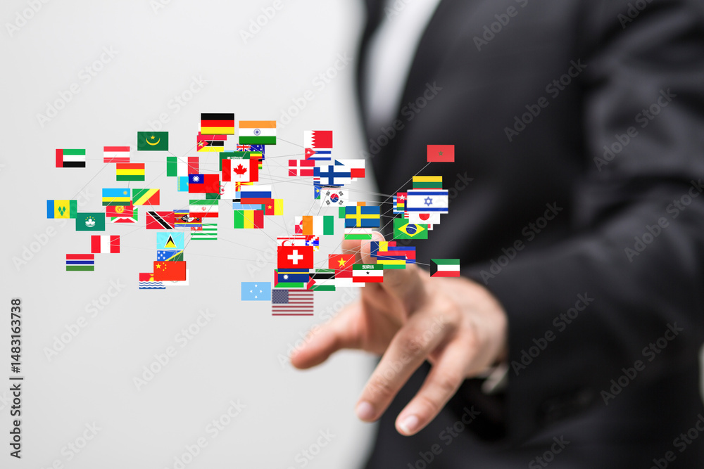 Poster image of a businessman interacting with a network of global flags, representing international busine