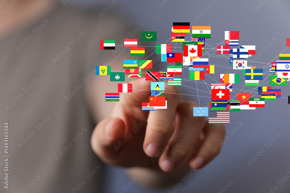 Aufkleber Hand interacting with a digital network of interconnected world flags, symbolizing global connectivity and international relations.