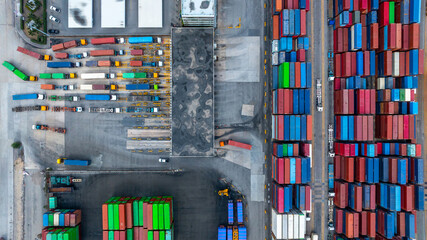 Aerial view semi trailer trucks stand on the parking lot and wait for loading and unloading cargo...