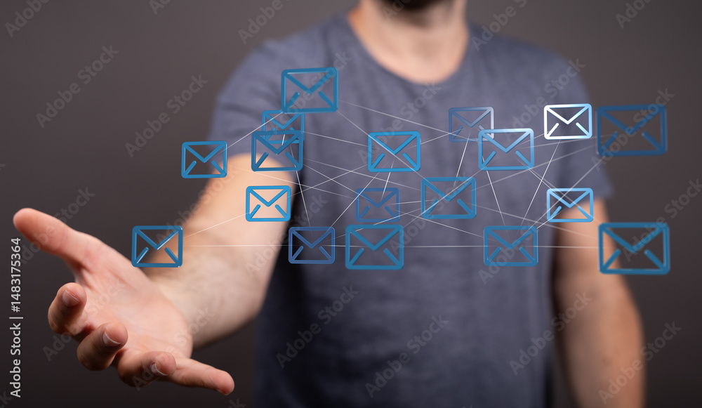 Poster Man's hand displays a network of interconnected email icons, symbolizing global communication and digital connectivity.