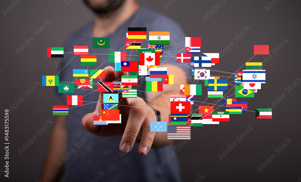 Poster Image of a hand interacting with a digital network of interconnected world flags, symbolizing global connection and communication.
