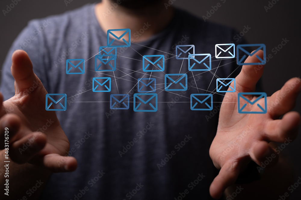 Aufkleber Man's hands display a network of email icons, symbolizing global communication and connectivity.