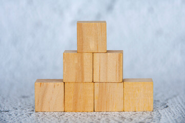 Close up of stacking wooden cubes with customizable space for text