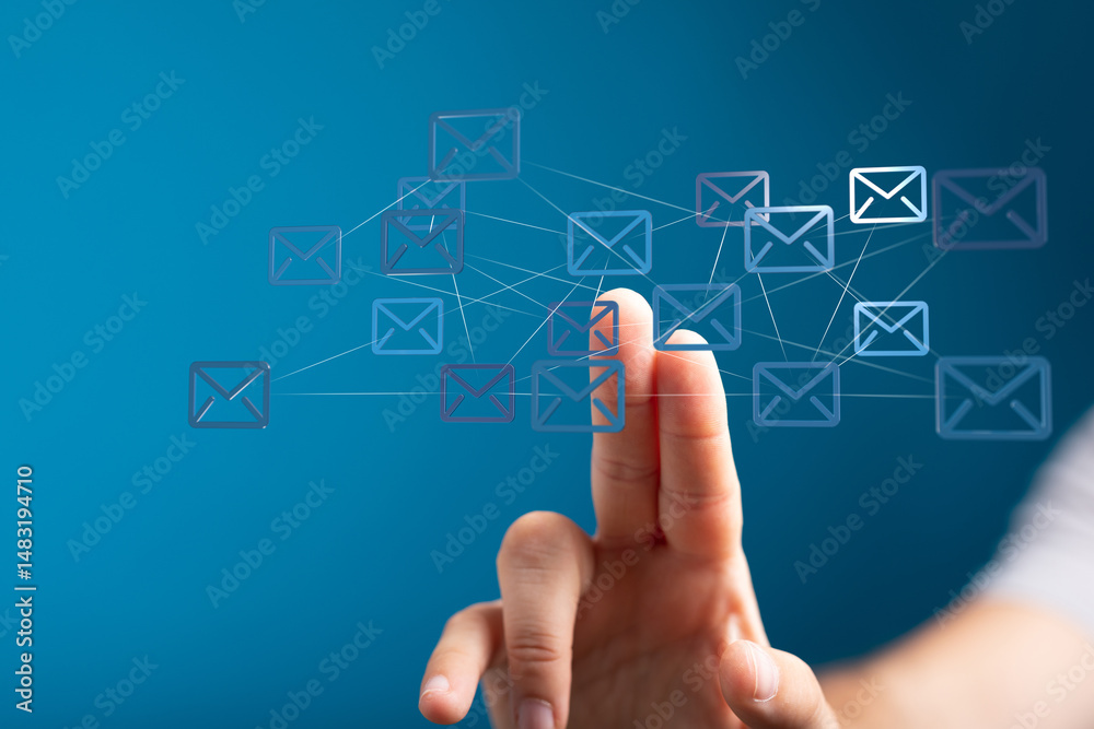 Poster Hand interacting with a digital network of email icons.  Concept of global communication and connectivity.