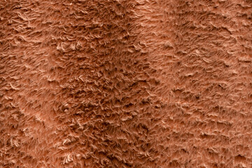 Texture of a brown faux fur as a background.