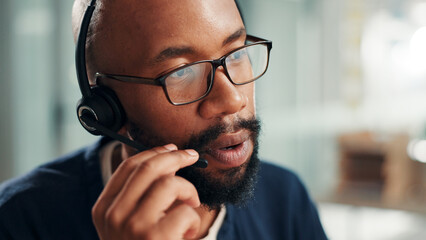 Black man, consultant and talking with headset at call center for online advice or customer...