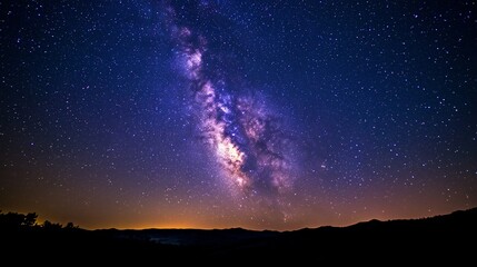 Fototapeta premium Majestic Milky Way over dark hills