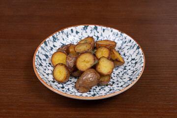 Grilled mini potatoes appetizingly grilled on a plate in a restaurant