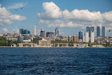 
Title:
Istanbul Waterfront Panorama with Historic Dolmabahçe Palace and Modern Skyscrapers - Turkish City Skyline View across Bosphorus Sea on Sunny Day with Clear Blue Sky
