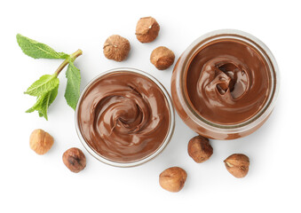 Tasty chocolate spread, hazelnuts and mint isolated on white, top view