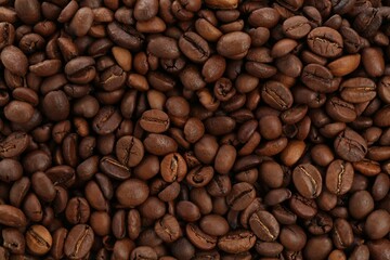Roasted coffee beans as background, closeup view