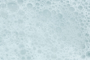Bubbles create a serene texture in a close-up view of foamy liquid