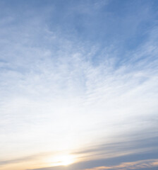 Front view and full frame of beautiful morning or evening blue and orange sky with cloudy while sunsets or sunrises taken at the sea used as natural blackground texture