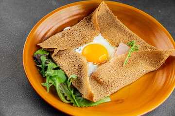 Fried egg galette sarrasin fried egg in crepe Breton galette complete fresh delicious gourmet food...