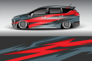 Obraz premium Sleek modified car with vibrant graphics in urban setting