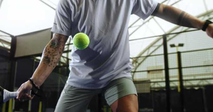 Super Slow Motion Close-Up of Focused Female Padel Player Hitting Forehand Shot on Indoor Court. Capturing Athletic Movement, Concentration, Precision During Competitive Racket Sport Match, 1000 fps