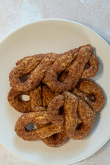 All Butter Cinnamon Sugar Knot biscuits, krakeling, sweet snack served ion plate