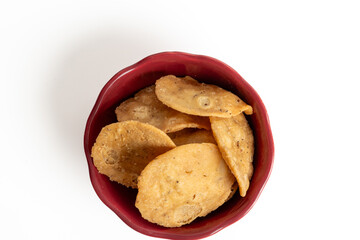 Mathri, or Mathi an Indian a flaky biscuit savoury snack made with all-purpose flour, wheat  flour. Top view.