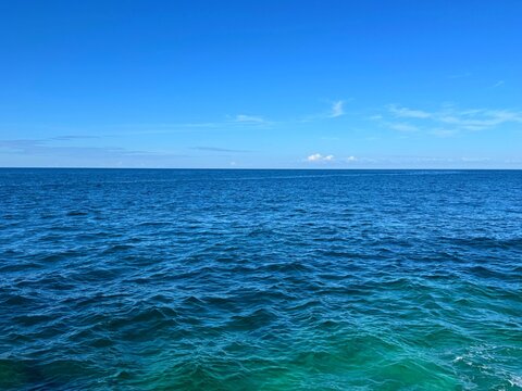 Ocean calm water and clear blue sky