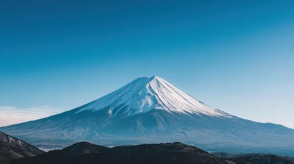 Fototapeta premium Majestic snowy peak under a serene blue sky, nature's beauty captured
