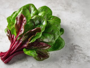 Vibrant bunch of red chard with rich green leaves, showcasing its fresh and healthy nature.  A burst of color.