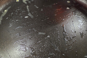 Nonstick Frying Pan Surface with Oil Residue in Kitchen Setting for Cooking Concepts