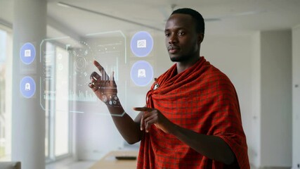 Man in traditional attire interacting with a holographic display in a modern office setting - Powered by Adobe