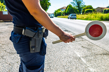 Policeman with a paddle close-up