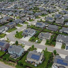 Fototapeta premium Aerial View of Suburban Neighborhood with Solar Panels