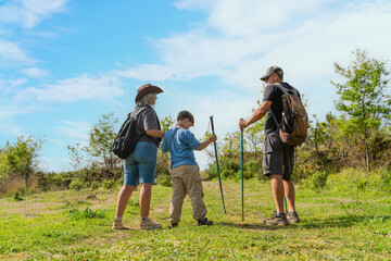 Family Hiking Adventure with Child  on Mountain Summit