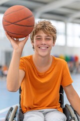 Smiling teenager in wheelchair holding basketball ball showing inclusion and sportsmanship