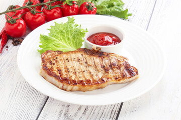 Grilled pork steak with ketchup