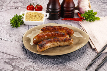 Delicous natural roasted sausages in the plate