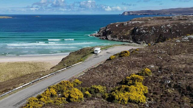 campervan parked on viewpoint overlooking ceannabeinne beach surrounded by rocky cliffs