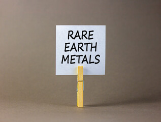 Rare earth metals symbol. Concept words Rare earth metals on beautiful white paper on wooden...