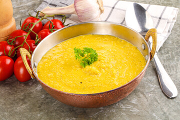 Vegetarian corn cream soup served parsley