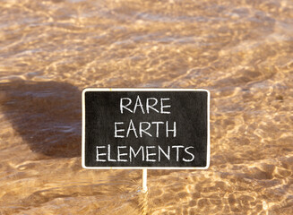 Naklejka premium Rare earth elements symbol. Concept words Rare earth elements on beautiful blackboard. Beautiful Red sea water background. Business and rare earth elements concept. Copy space.
