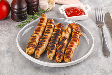 Grilled meat sausages wrapped bacon