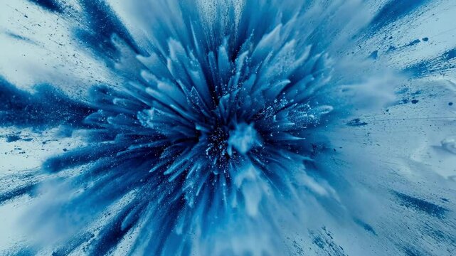 blue paint powder exploding in abstract radial burst motion on white surface, vibrant splash